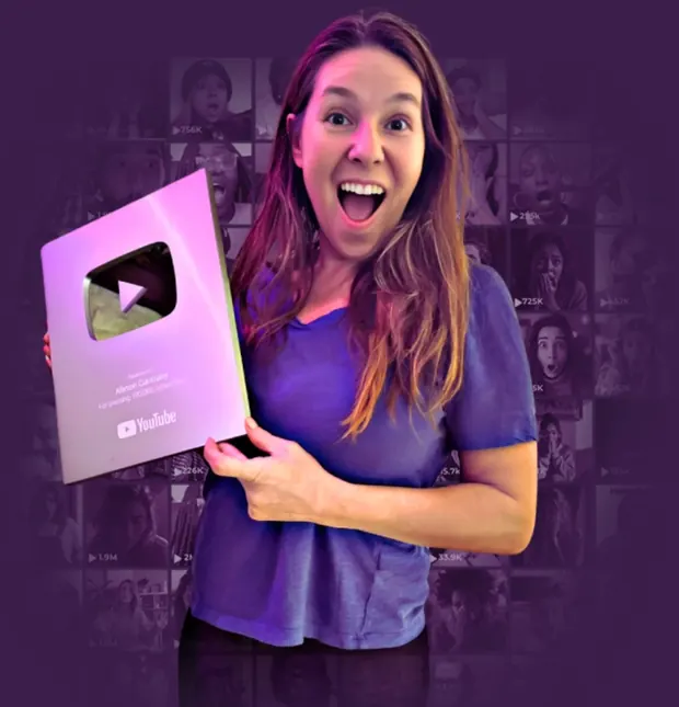 Allison holding her YouTube Silver Creator Award